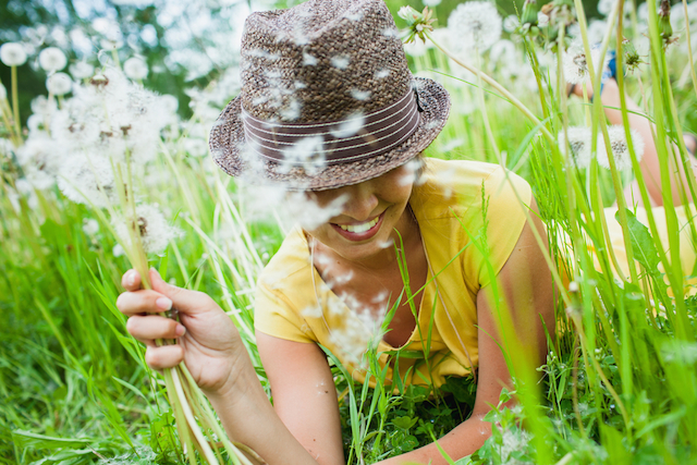 Happy Woman with Dandelions